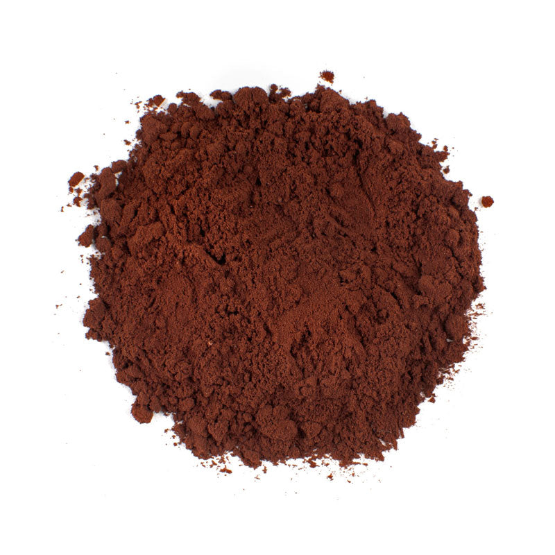 DUTCH PROCESSED COCOA POWDER -10 lb bag / box in a mound, showcasing its rich dark color and fine texture.