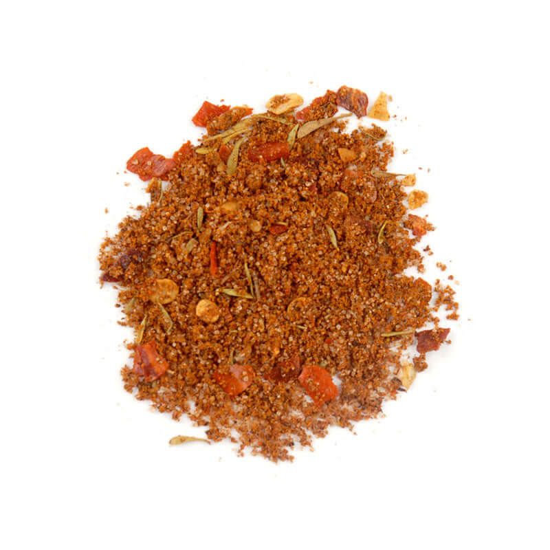 Caribbean Heat Seasoning blend of spices including allspice, thyme, and chiles for flavorful cooking.