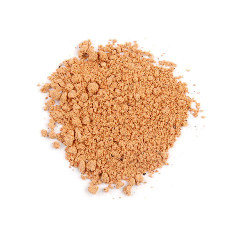 Taco Seasoning pile of spices on a white background showcasing its rich color and texture.