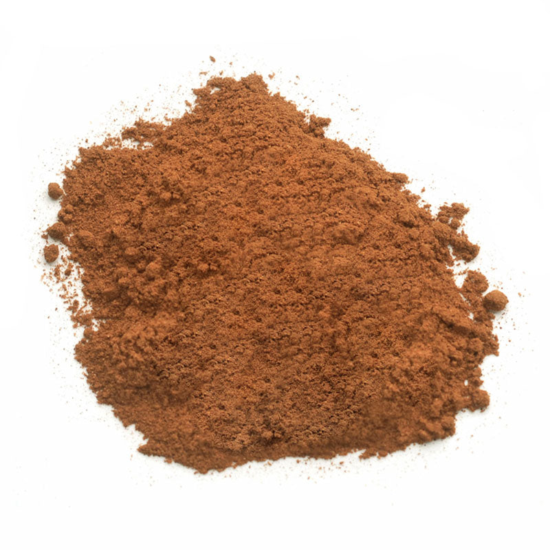VIETNAMESE GROUND CINNAMON - 10 lb bag / box each, aromatic cinnamon powder pile against a white background