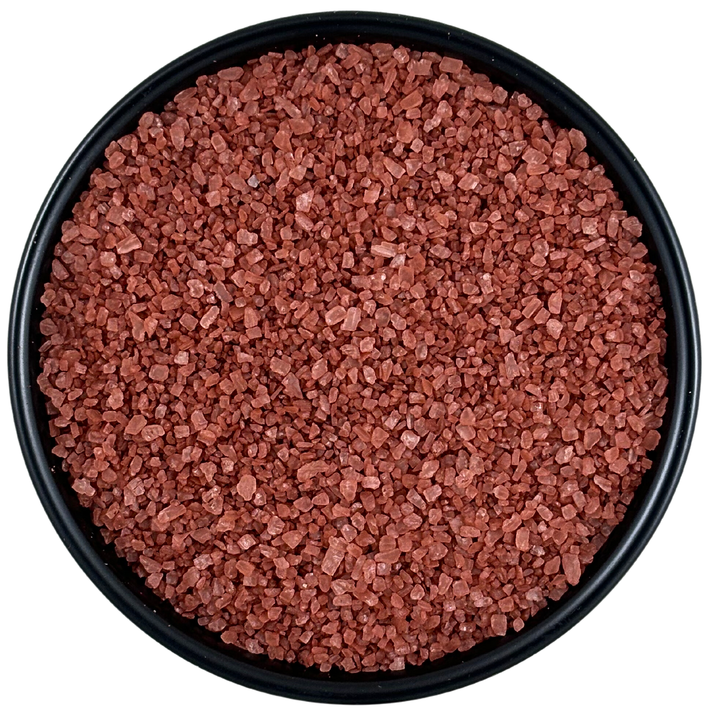 Alaea Red Sea Salt - Chef Pinch Jar - Case Pack - 8 units in a black dish, showcasing its earthy reddish hue.