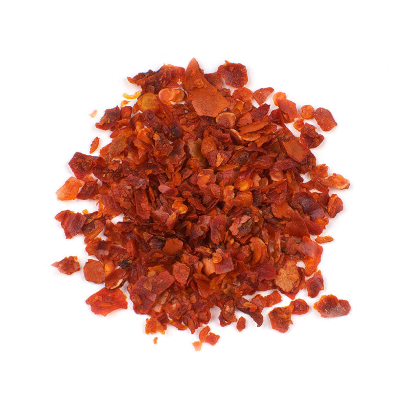 CRUSHED MEDITERRANEAN ALEPPO - 25 lb bag / box each, vibrant deep red flakes of Aleppo pepper on a white background.