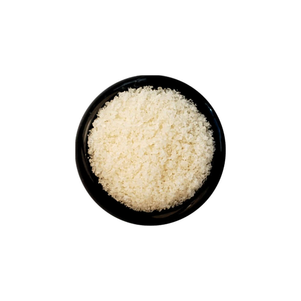 New Zealand Sea Salt - Fine in a black bowl, showcasing the fine grain size of the salt.