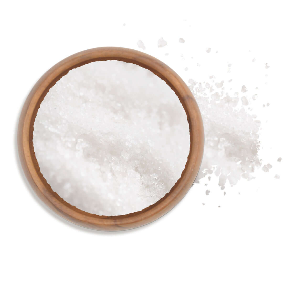 Flor de Sal in a wooden bowl with scattered flakes, ideal for flavoring and garnishing dishes.