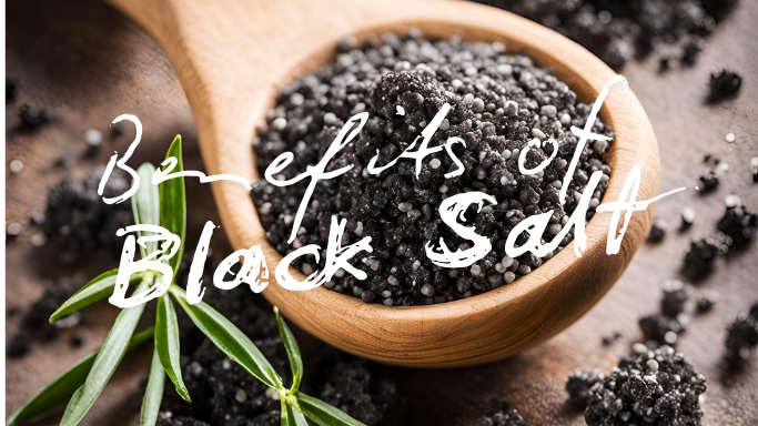 Benefits of Black Salt (Kala Namak) in a wooden spoon with green herbs.