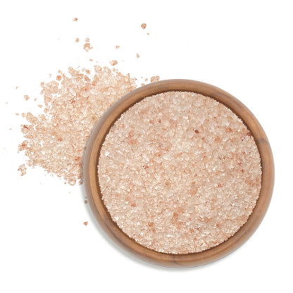Himalayan Pink Salt - Chef Pinch Jar - Case Pack - 8 units in a wooden bowl with salt grains scattered around.
