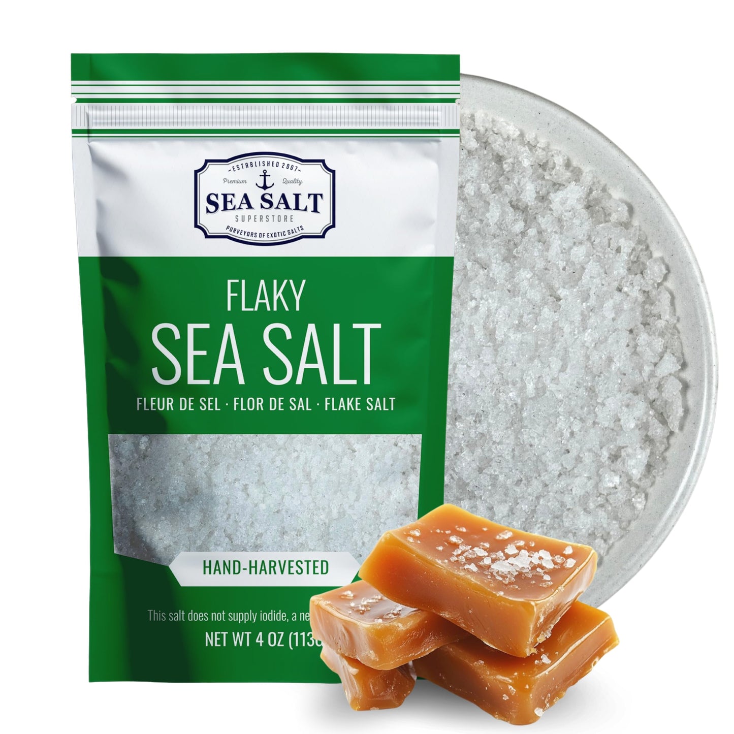 Mini Flake Sea Salt - 4 oz Pouch with flaky sea salt and caramel candy on a plate.