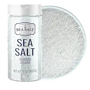 Coarse Grain Sea Salt - 16 oz Shaker with visible sea salt crystals in a clear container and dish.